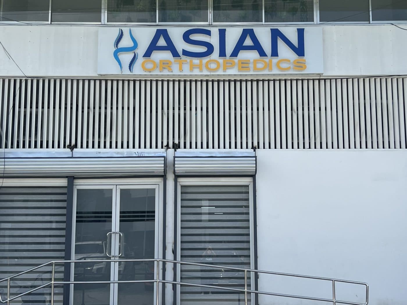 Asian Orthopedics clinic entrance with wheelchair ramp, Constellation Business Plaza